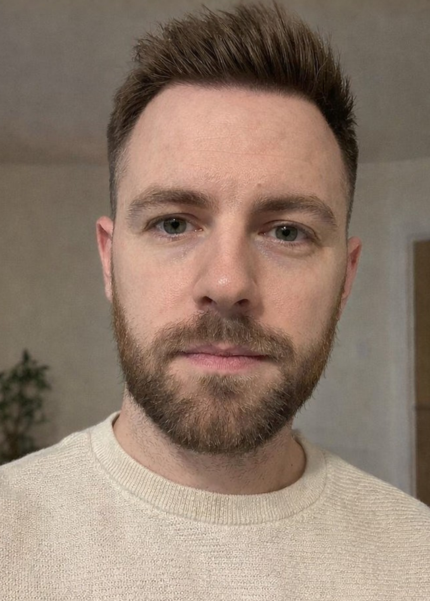 Side-by-side comparison of a man with and without a beard, holding a bottle of Cray Bull product.