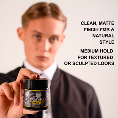 Person holding a jar of Crazy Bull MattMeUp hair product with text about product features.