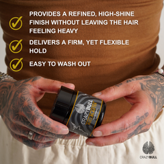 Person holding a container of Crazy Bull Bull Blaster Water Pomade with text highlighting its features.