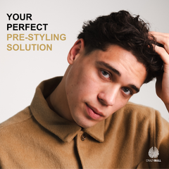 Man styling his hair using Bull Blaster Salt Spray with text 'Your Perfect Pre-Styling Solution' and 'Crazy Bull' logo.
