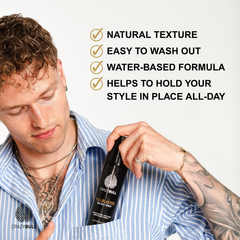 Man holding a bottle of Crazy Bull Bull Blaster Salt Spray with text highlighting features on a white background