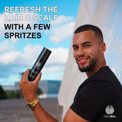 Man holding a bottle of Crazy Bull Cool Bull Tonic Spray with text overlay against a blurred outdoor background