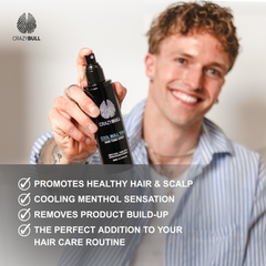 Man holding a bottle of Crazy Bull Cool Bull Tonic Spray with promotional text on a blurred background